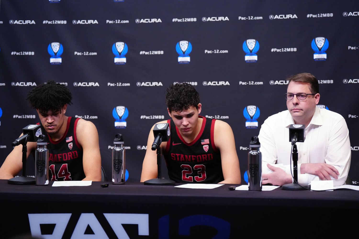 Mar 14, 2024; Las Vegas, NV, USA; Stanford Cardinal forwards Spencer Jones (14) and Brandon Allen (23) and head coach Jerod Haase react at press conference after the game against the Washington State Cougars at T-Mobile Arena. Mandatory Credit: Kirby Lee-USA TODAY Sports